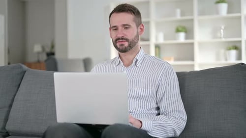Man on Laptop Video Chatting