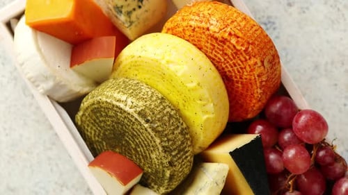 Cheese Platter with Grapes Rotating Slowly