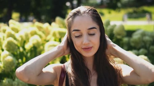 Attractive Woman Posing in a Park on Sunny Day