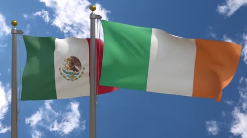 Realistic Waving Flags of Mexico and Ireland Against Blue Sky