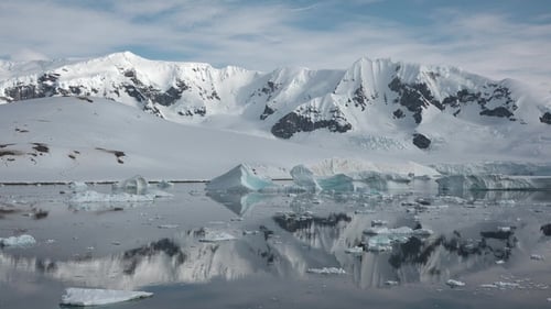 Snowy Mountains and Icebergs in the Arctic