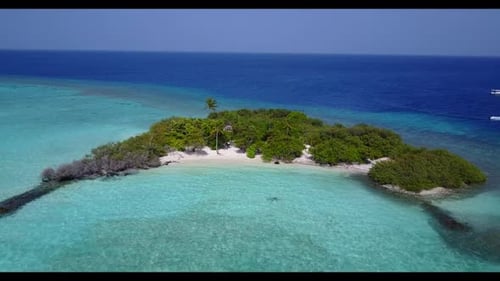 Aerial flying over texture of tranquil seashore beach trip by aqua blue sea and white sand backgroun