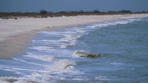 Seashore with waves crashing on the beach