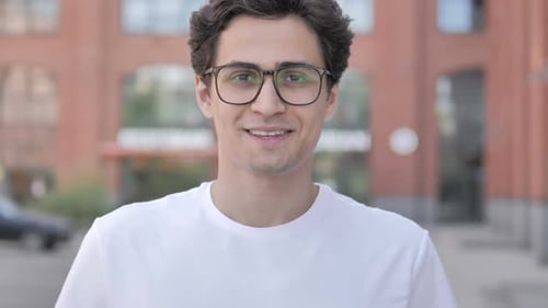 Young Adult Smiling Outdoors