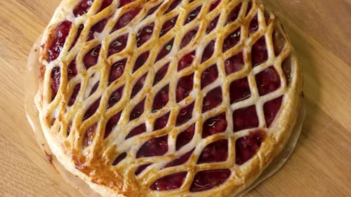 Delicious Cherry Pie with Lattice Crust on Wood