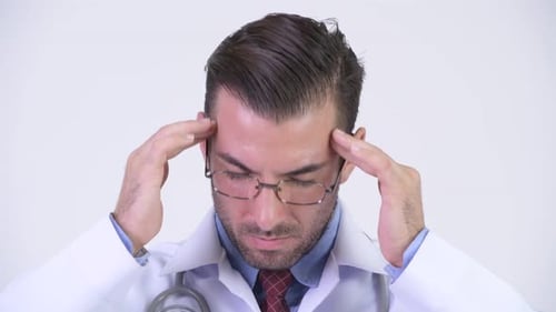 Doctor Massaging Temples Due to Stress