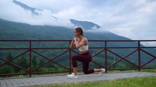 Woman Doing Lunges With Mountain View
