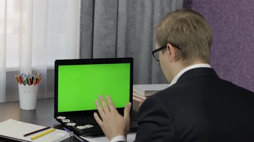Man Teacher Making Online Video Call on Laptop. Green Screen. Distance Education
