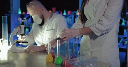 Scientists Conducting Research in a Laboratory at Night