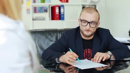 Young Businessmen Sign A Contract.