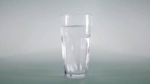 Effervescent Tablet Dissolving in a Glass of Water