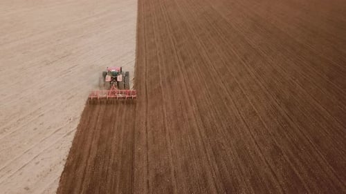 Tractor Plows a Field