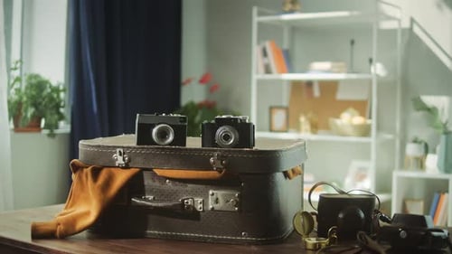 Vintage Suitcase with Cameras Indoors