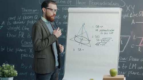 Man Teaching Mathematics in Front of Whiteboard