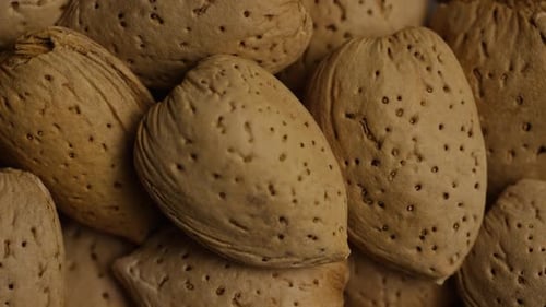 Cinematic, rotating shot of almonds on a white surface - ALMONDS 130