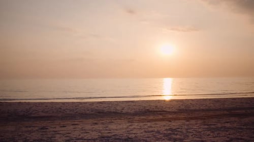Beautiful Beach at Sunrise with Gentle Waves