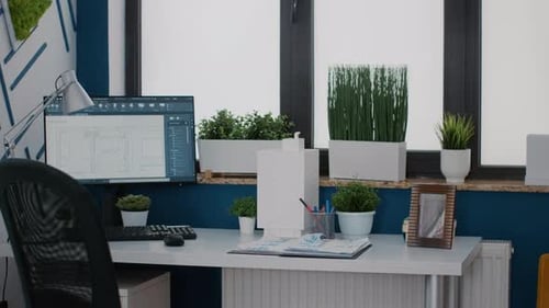 Close Up of Monitor with Digital Blueprints Plans on Desk for Architecture Design of Building Layout