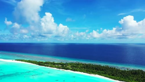 Aerial drone shot tourism of exotic tourist beach break by blue water and white sand background of a