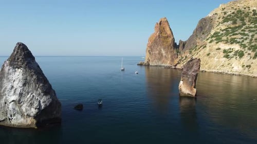 Aerial View From Above on Calm Azure Sea and Volcanic Rocky Shores