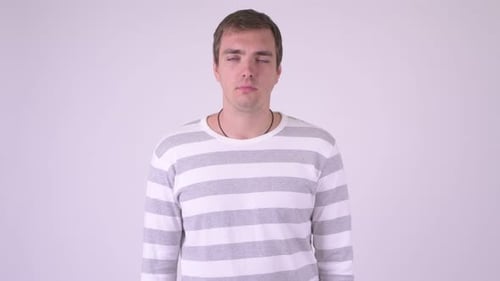 Man Rolling Eyes in Front of White Background