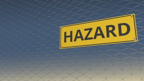 Animated Hazard Warning Sign on Metal Mesh Fence