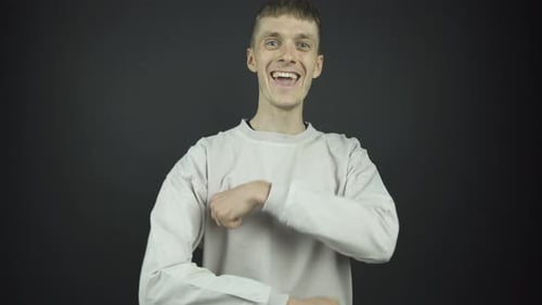 Man Smiling and Laughing at Camera