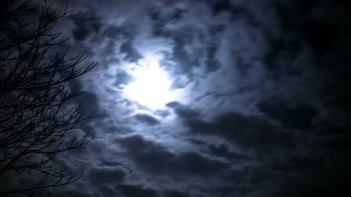Billowing Clouds and Moonlit Night Sky