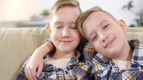 10-Year-Old Caucasian Twins Posing for Camera
