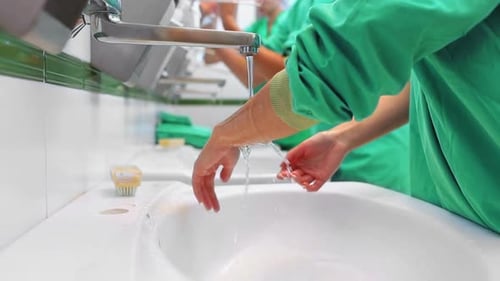 Hospital staff brushing hands
