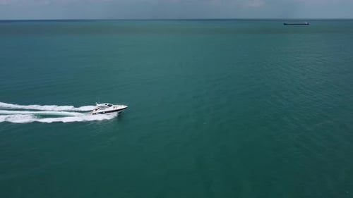 Aerial Top Down View of Speed Motor Boat on Open Sea at Summer Day
