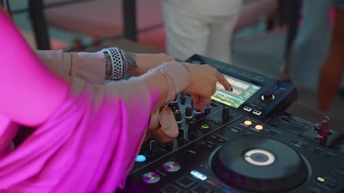DJ Mixing Music at a Vibrant Nightclub Party