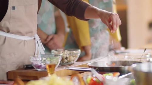 Adults Cooking Together Preparing Healthy Meal