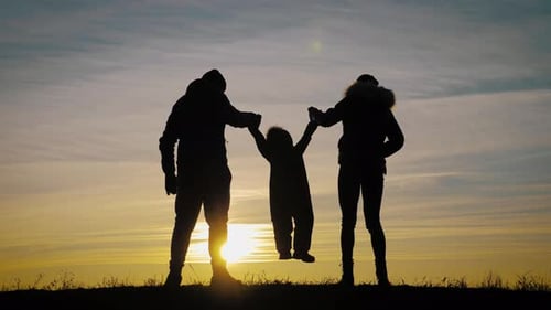 Family Silhouette at Sunset