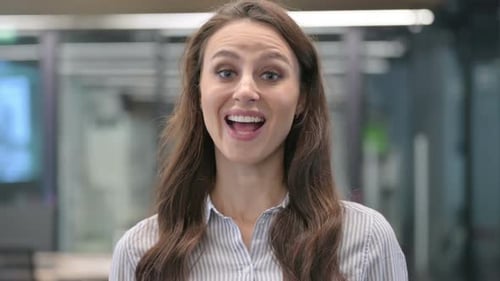 Smiling Woman Talking in Office