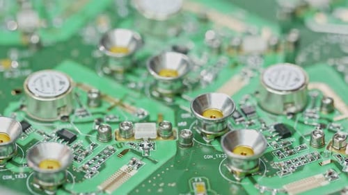 Close up of manual soldering of a large circuit board