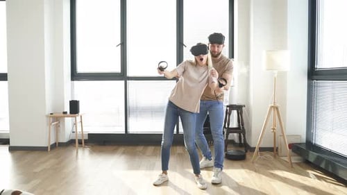 Couple Enjoys Virtual Reality Experience at Home