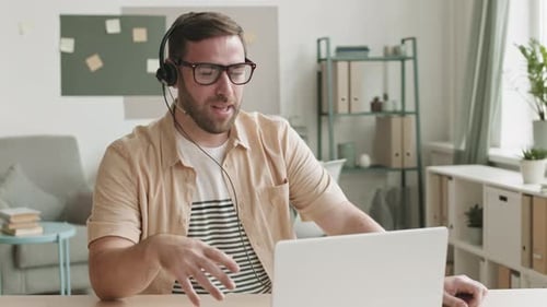Man Working from Home on Video Conference