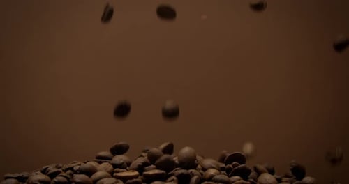 Roasted Coffee Beans Falling on Pile
