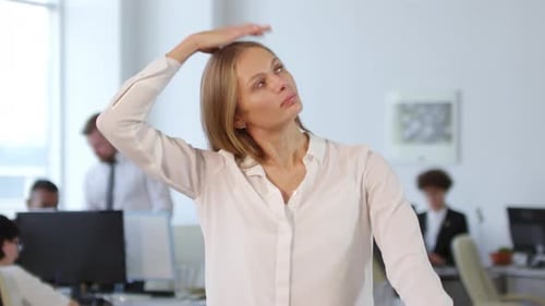 Woman Warming up in Office