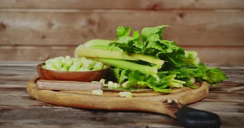 Fresh Celery Preparation on Wooden Table