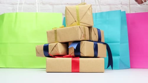 Pile of Beautifully Wrapped Gifts and Shopping Bags