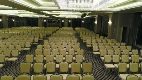 Expansive Conference Room Setup with Rows of Empty Chairs