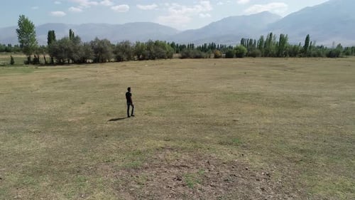 Man Walking Alone In Nature