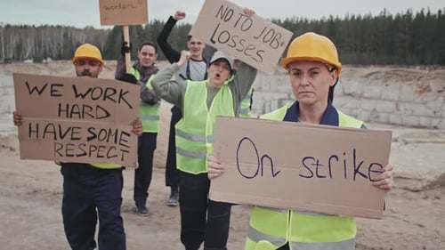 Striking Quarry Workers Holding Protest Signs