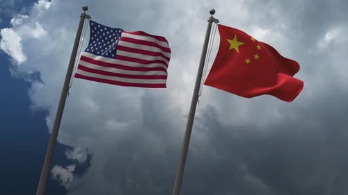 USA and China National Flags Waving Against Cloudy Sky
