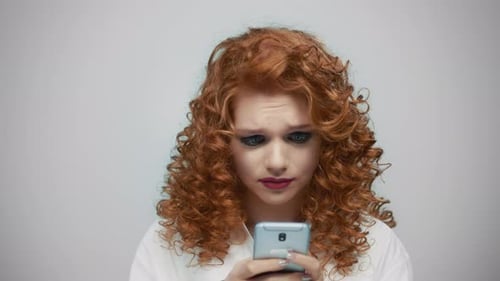 Sad Woman Cries Looking at Phone