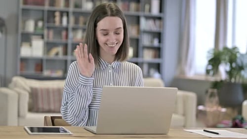 Woman Video Conferencing on Laptop in Living Room