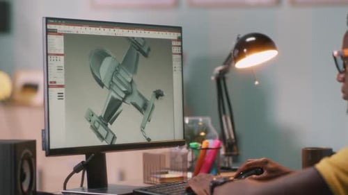 Black Man Browsing 3D Model on Computer