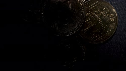 Gold Bitcoin Coins on Dark Background Close Up