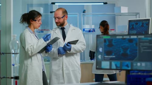 Scientists Collaborating on Research in Modern Laboratory